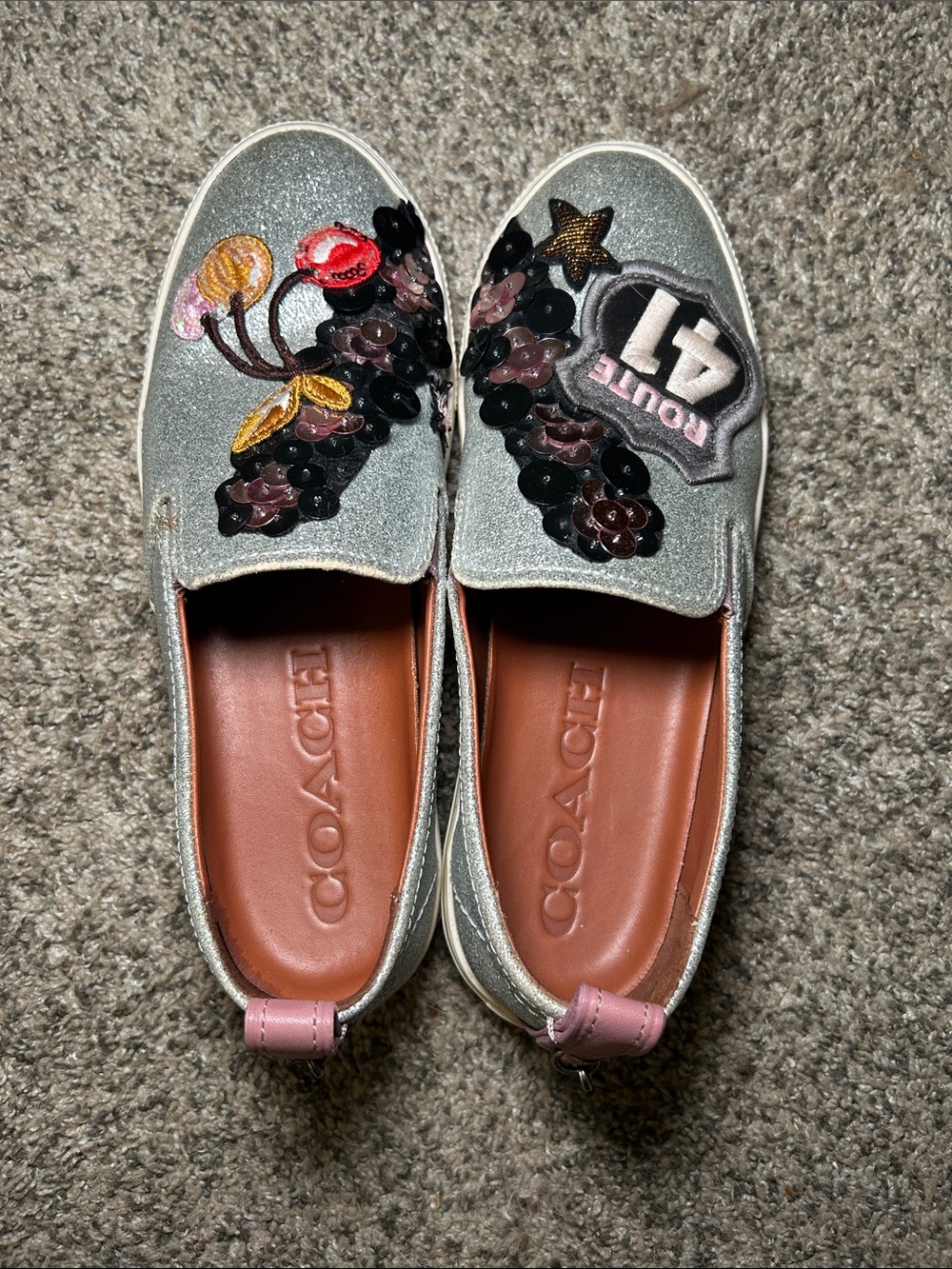 Coach C115 sneakers with a silver glitterβ finish and Route 41 patches. Size 8